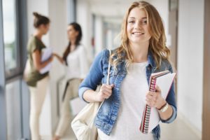 Student In Hallway Smiling